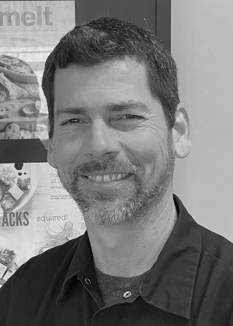 Headshot of a man named Tom Baxter.